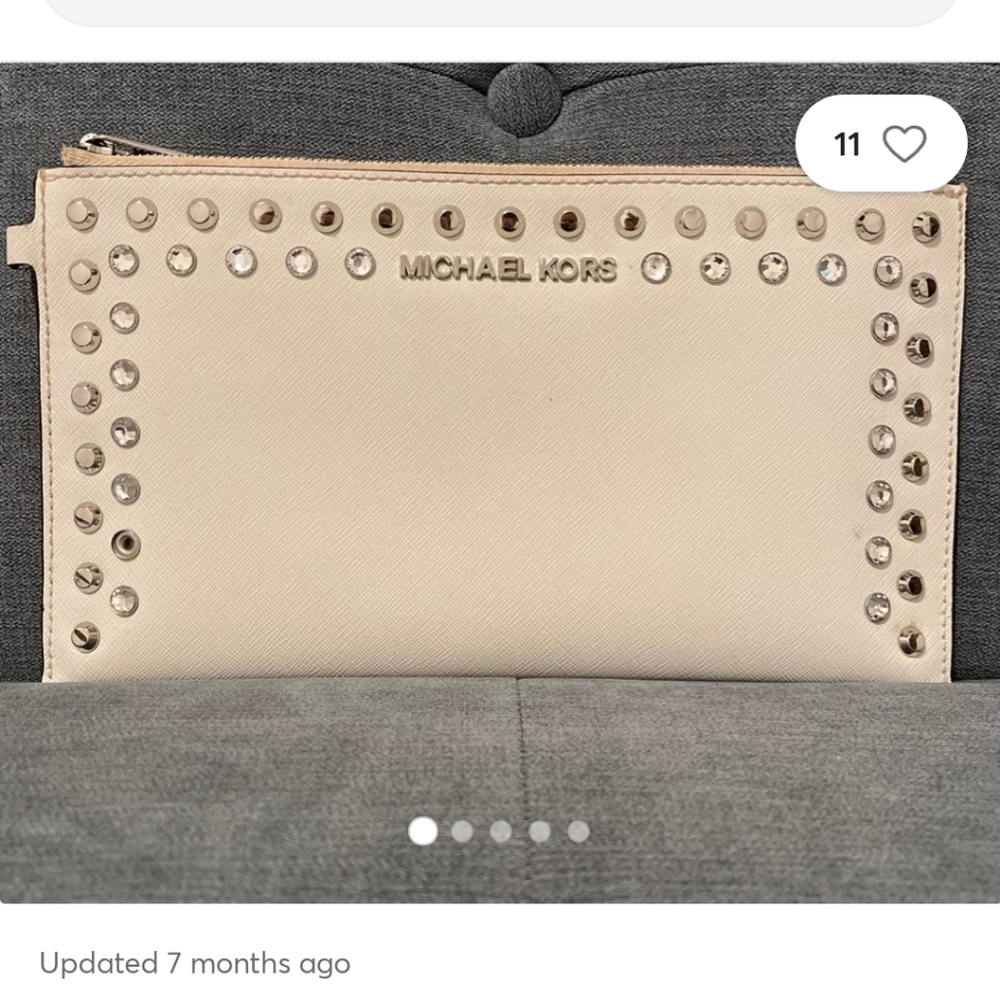 MICHAEL KORS CLUTCH IVORY STUDS AND GEMS ON FRONT ITS SLIGHTLY USED